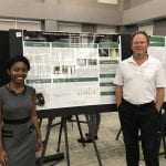 REU Sherilynn Knight with Faculty Mentor Dr. Alan Eberhardt. Sherilynn won 2nd place in the Engineering category at the Expo