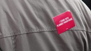 a pic of a sticker that reads I Stand With Planned Parenthood