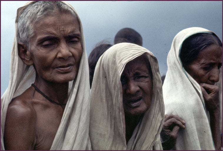 Three refugee Bengali women look sad. 