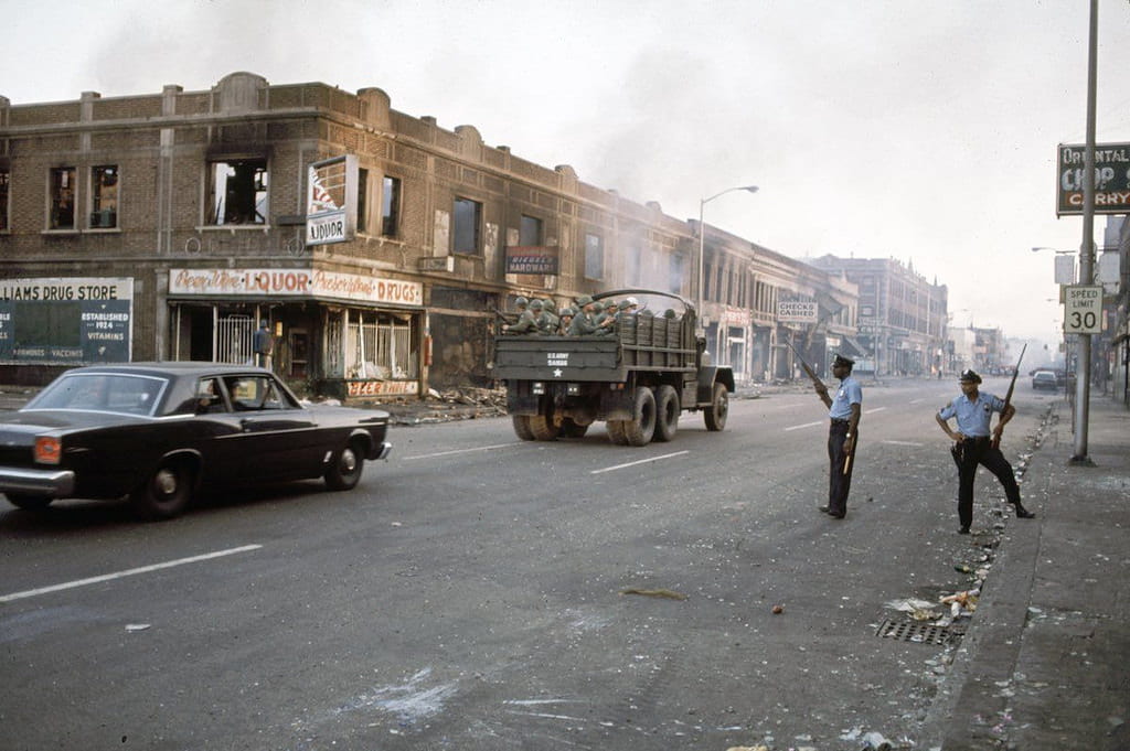 a picture of the National Guard and the police in Detroit, 1967 following the riots