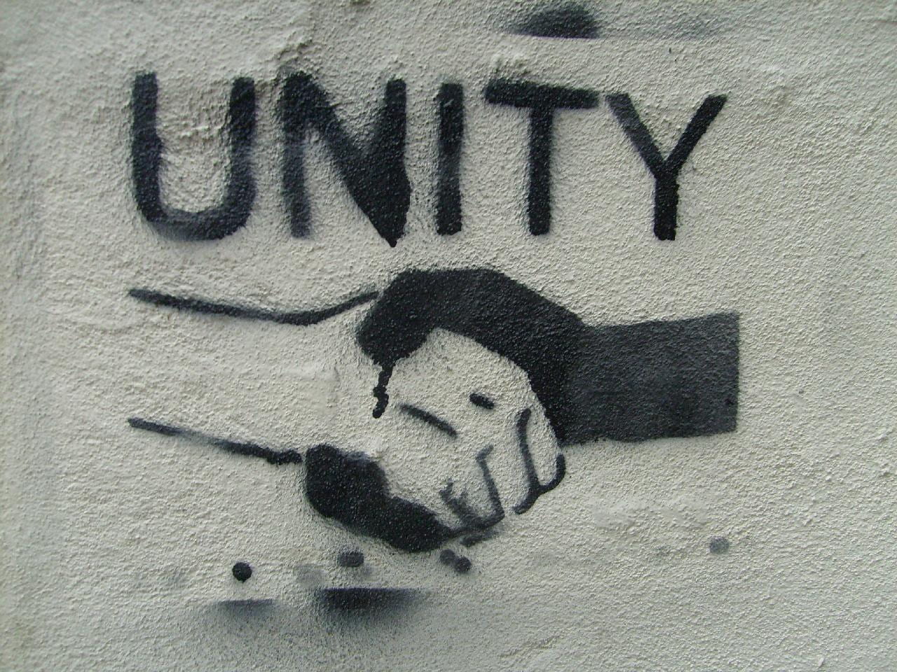 a graffiti that reads UNITY