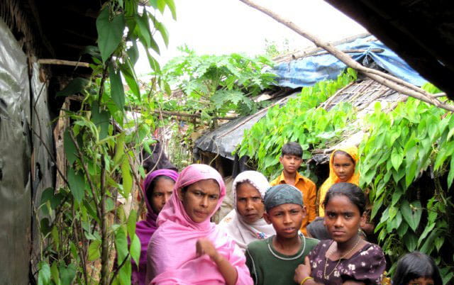 Rohingya Refugee Women Stand By Their Homes