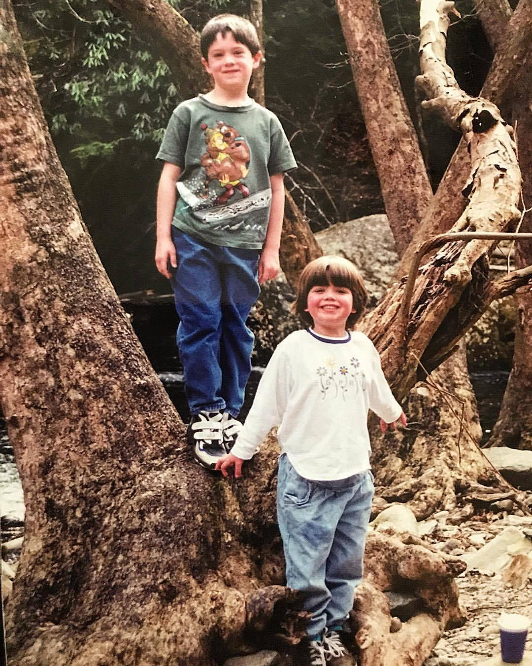 The author and his sister in childhood climbing a tree.