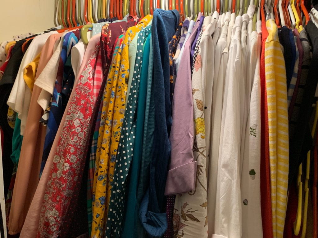 a picture of clothing in a closet