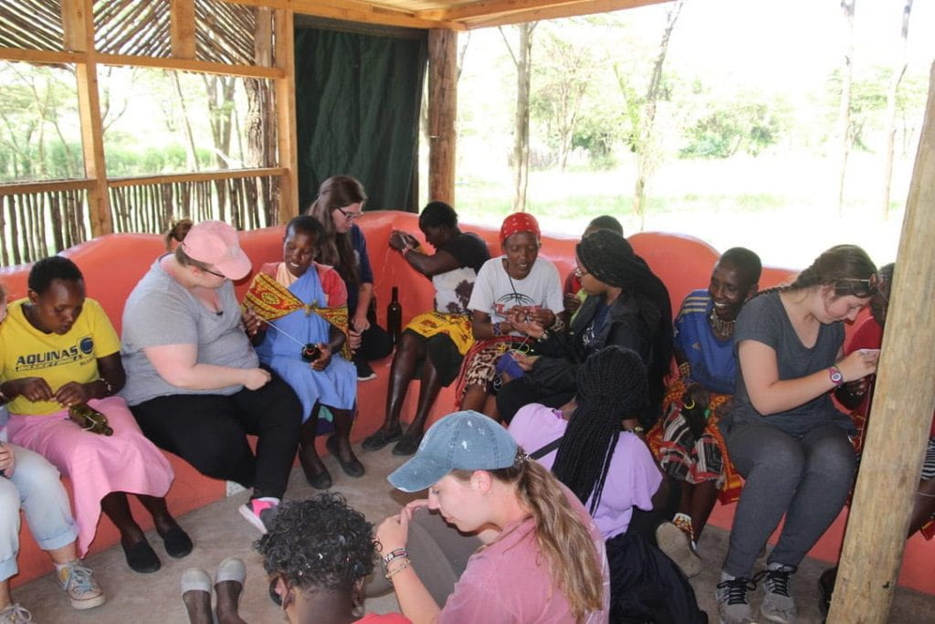 Emma and the Maasai women sitting in a circle having conversation