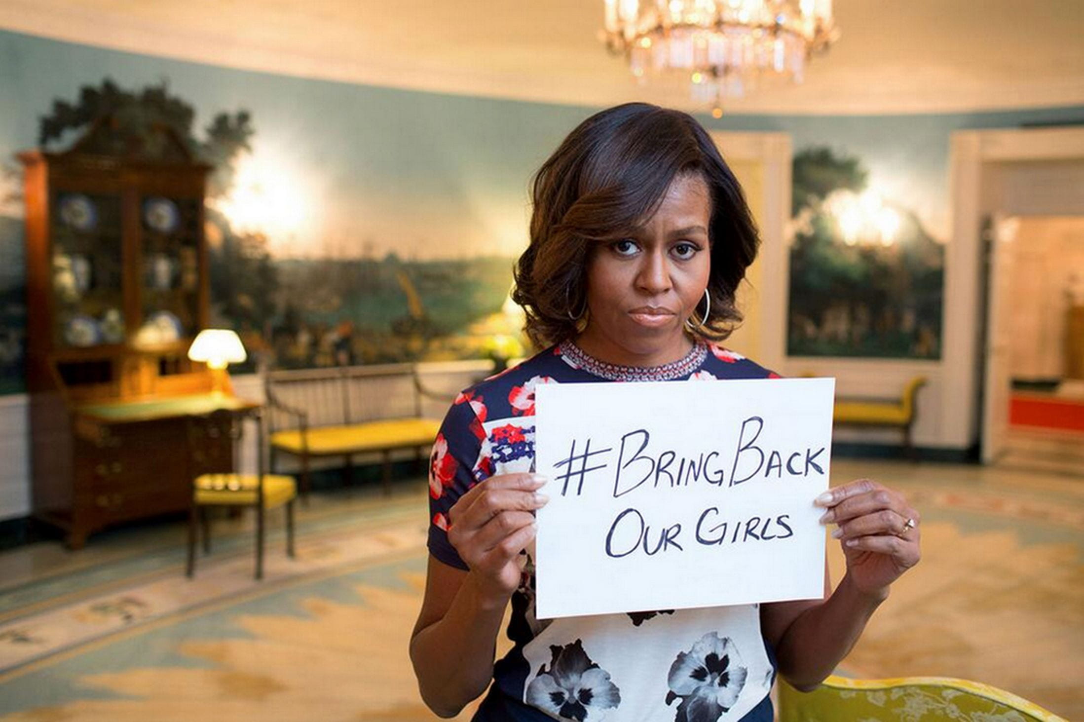 An image of former First Lady Michelle Obama holding up a sign saying #BringBackOurGirls.