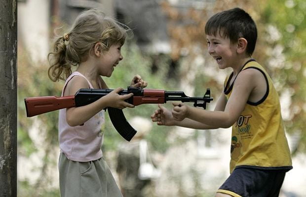 Kids playing with a gun
