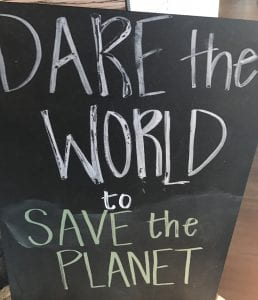 Chalkboard reading: "Dare the World to Save the Planet"