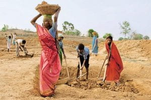 Rural women in India performing their daily duties. Source: Yahoo Images.