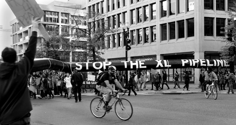 A fake pipeline with the words "stop the xl pipeline" protesting the pipeline