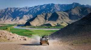 Photo of armored car driving through mountains of Afghanistan