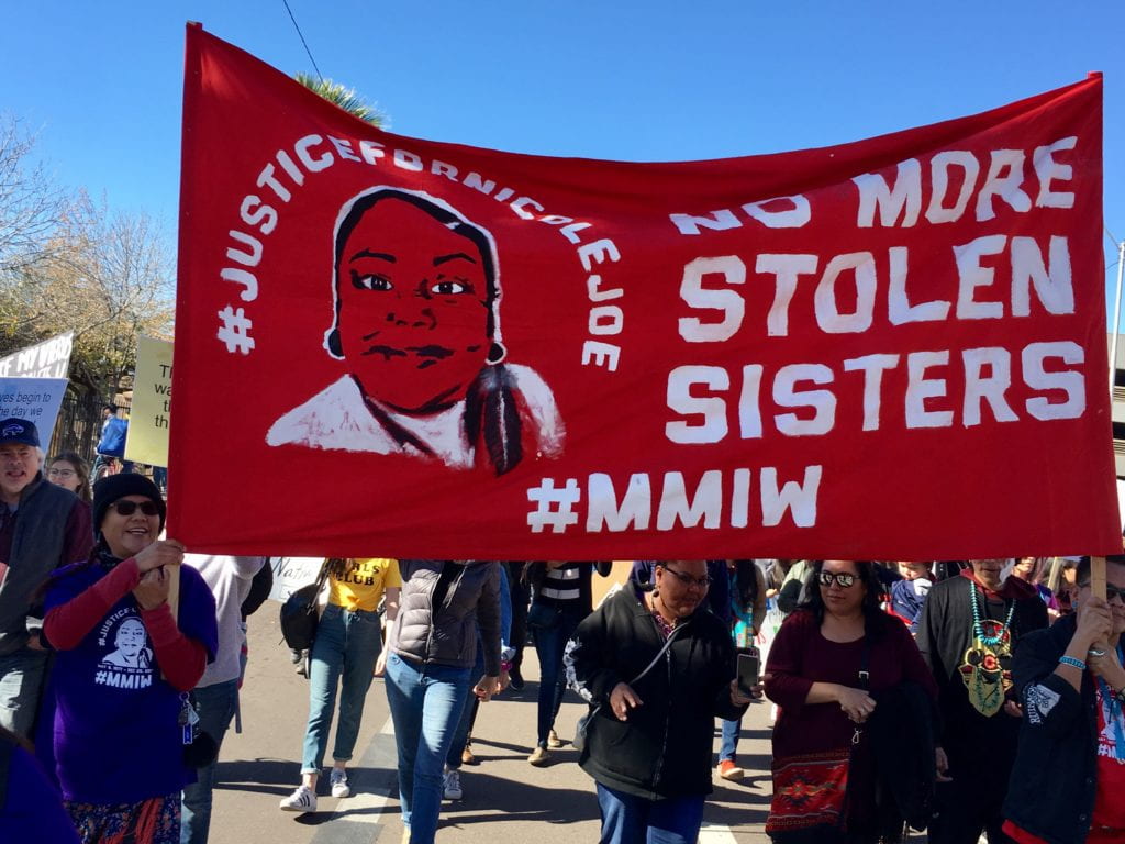 Banner with the words "No more Stolen Sisters" at a protest for missing indigenous women
