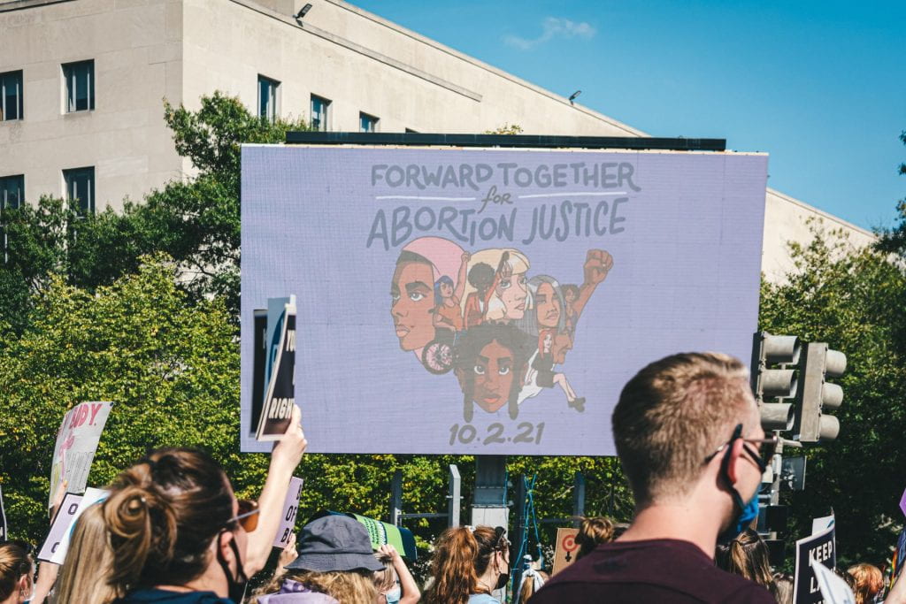 Billboard titled "Forward Together for Abortion Justice"