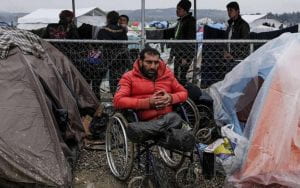 Disabled man in a refugee camp