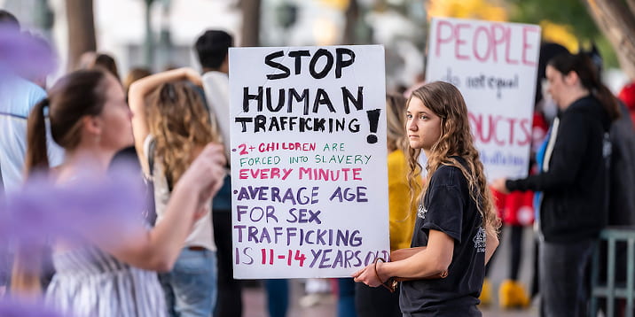young protestors show their support for stopping human trafficking.