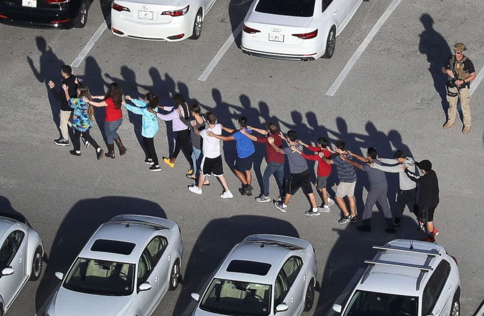 Children march from a school shooting