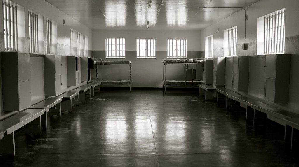 Image shows an empty cell area of a prison.