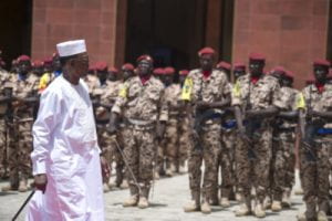 Former President Idriss Deby walking in front of Chad's military forces.