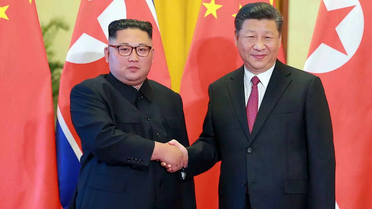 Kim Jong-Un, the Supreme Leader of North Korea shakes hands with Xi Jinping, the President of China.