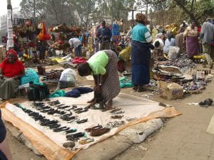 Women sell goods in Kenya market