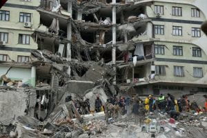 Rescue workers search for survivors under the rubble following an earthquake in Diyarbakir, Turkey, Feb. 6, 2023. A powerful 7.8 magnitude earthquake rocked areas of Turkey and Syria early that morning, toppling hundreds of buildings and killing more than 2,000 people. (OSV News photo/Sertac Kayar, Reuters)