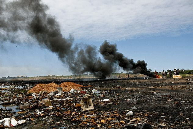 An image that shows the toxic air pollution coming from near a landfill, burning electronic waste.