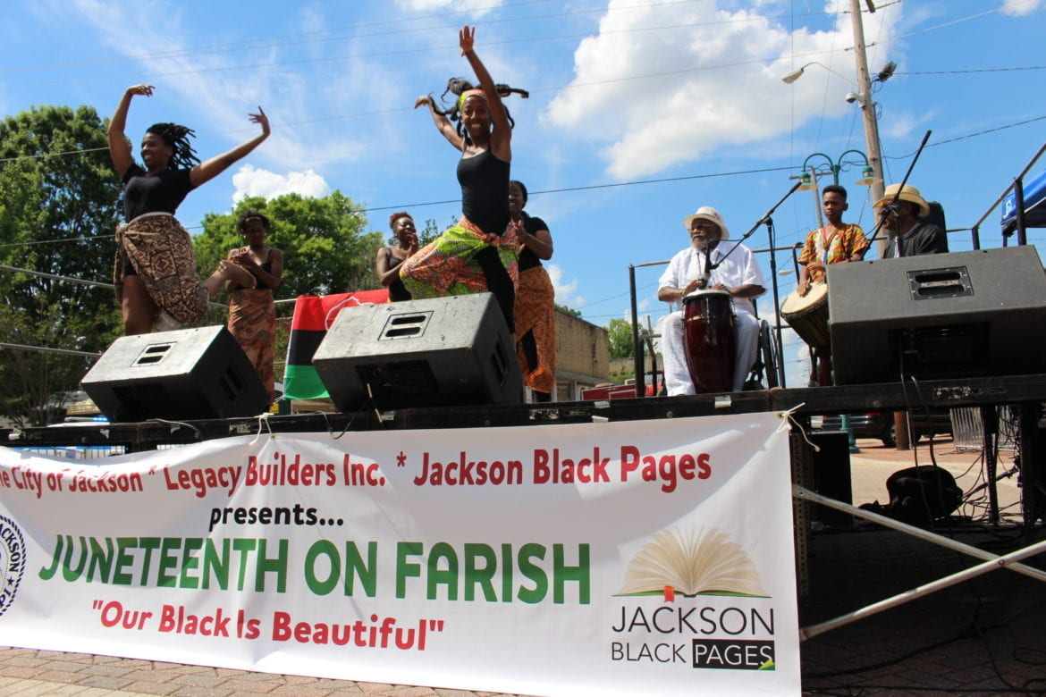 Alt text: An image depicting a Juneteenth celebration with song and dance, in a celebration of cultural heritage. 