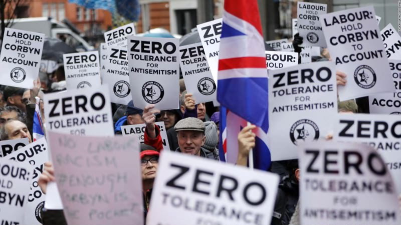Many people carrying signs stating “Zero Tolerance For Antisemitism.” Source: Yahoo Images