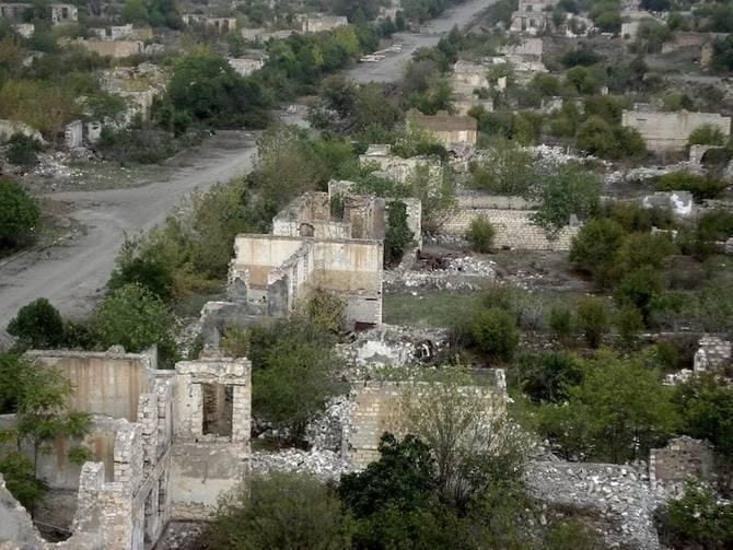 This image depicts a destroyed city in Nagorno-Karabakh from the first Armenia and Azerbaijani conflict.