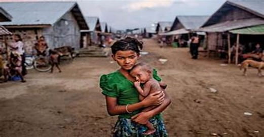 Figure 2 Young girl holding a child in detention sites in Myanmar. Source: Yahoo Images