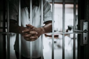 Man behind jail bars 